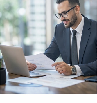 Recruiters and hiring managers reviewing candidate profiles in a modern office